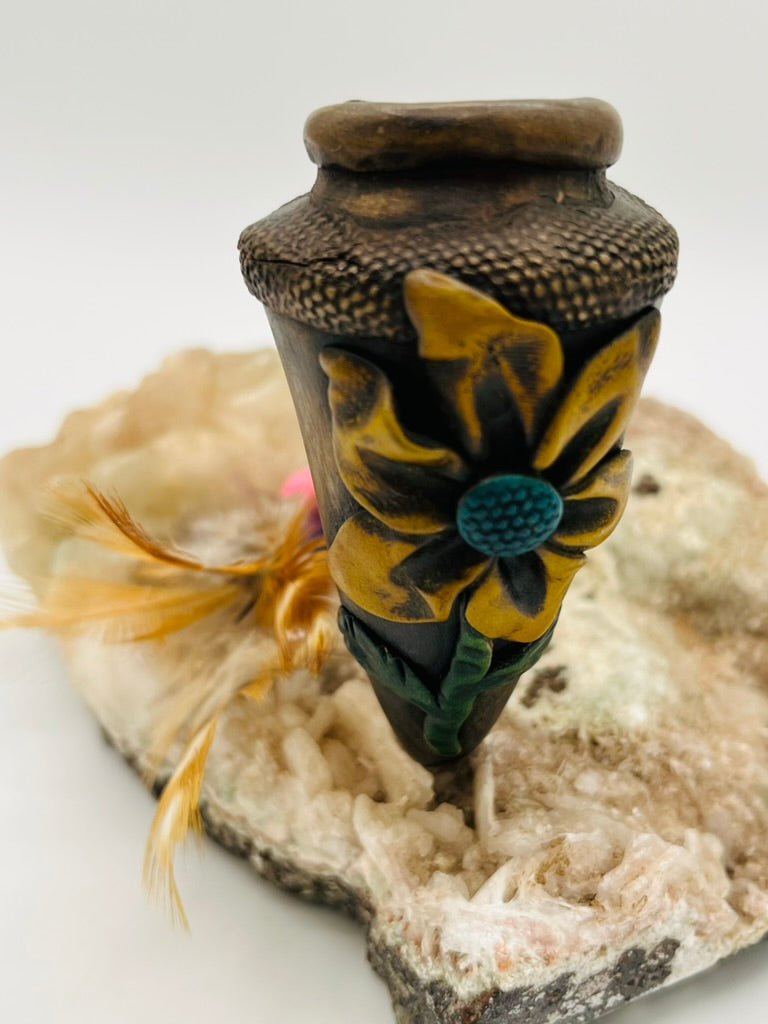 Flower carving detail on handcrafted large bamboo peace pipe by Collective Journey Art