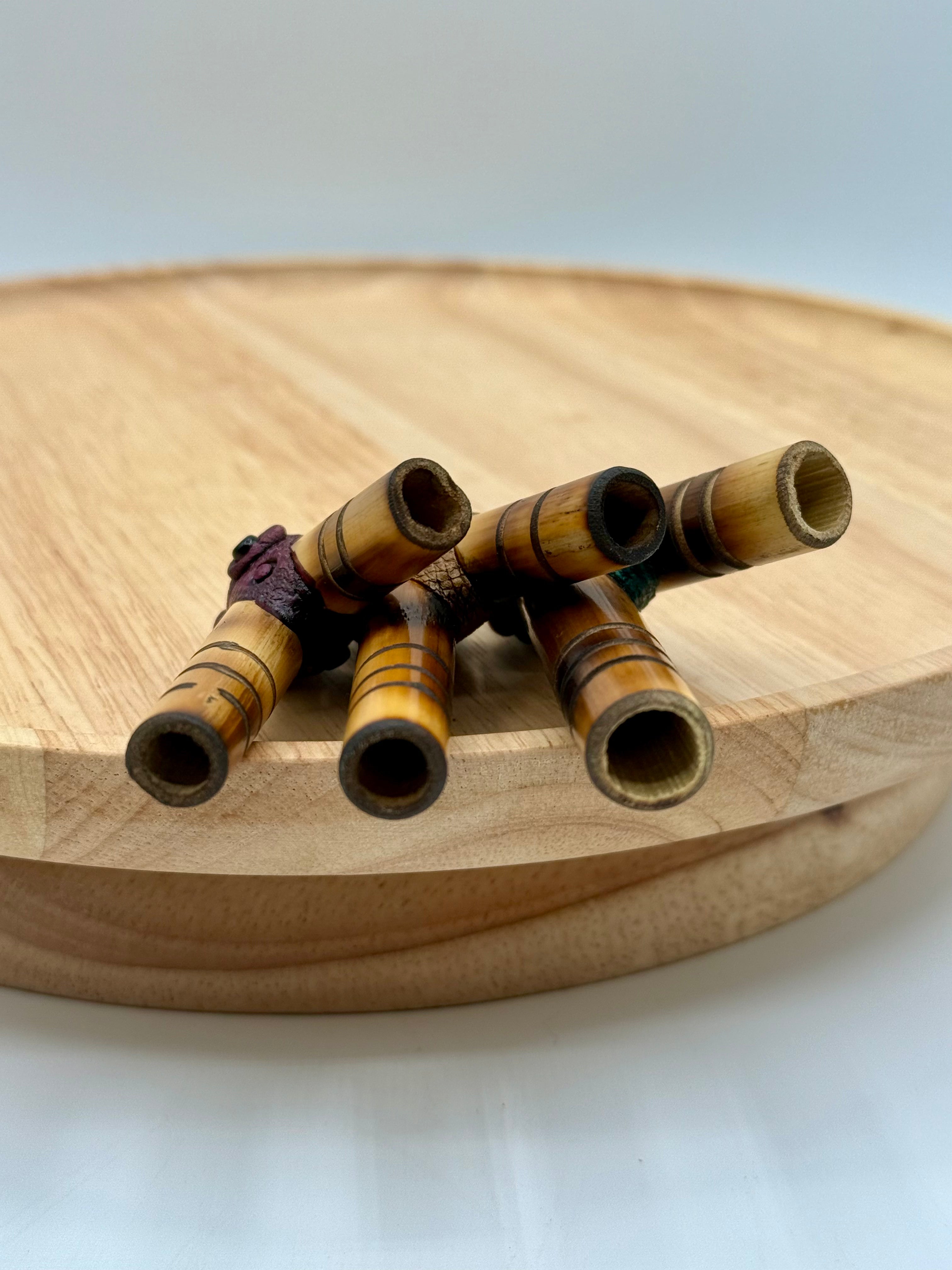 Three handcrafted Bamboo Kuripes arranged to compare the available Small, Medium, and Large nostril gauge sizes.