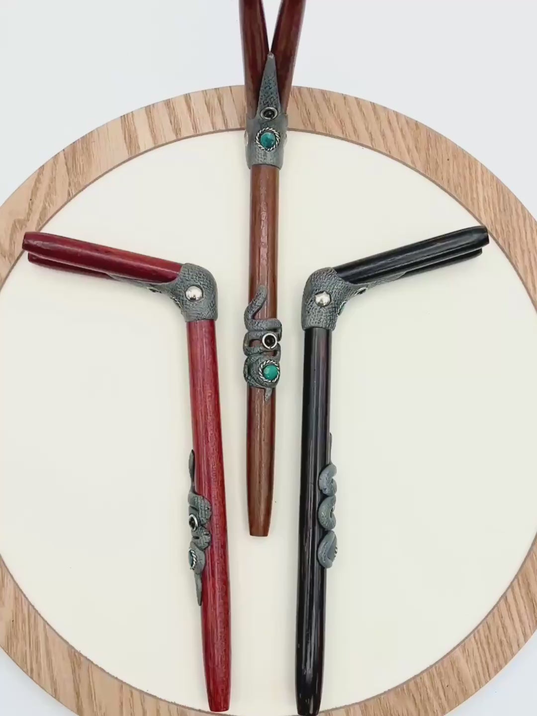 Video of handcrafted Double Snake Tepi by Collective Journey Art, a double-nostril Hapé serving applicator with carved serpent details and a natural chrysocolla accent.