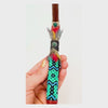 Handcrafted Indigenous Tepi Hapé serving applicators by Collective Journey Art, made from Amazonian blackwood with colorful Shipibo-inspired seed-bead patterns.